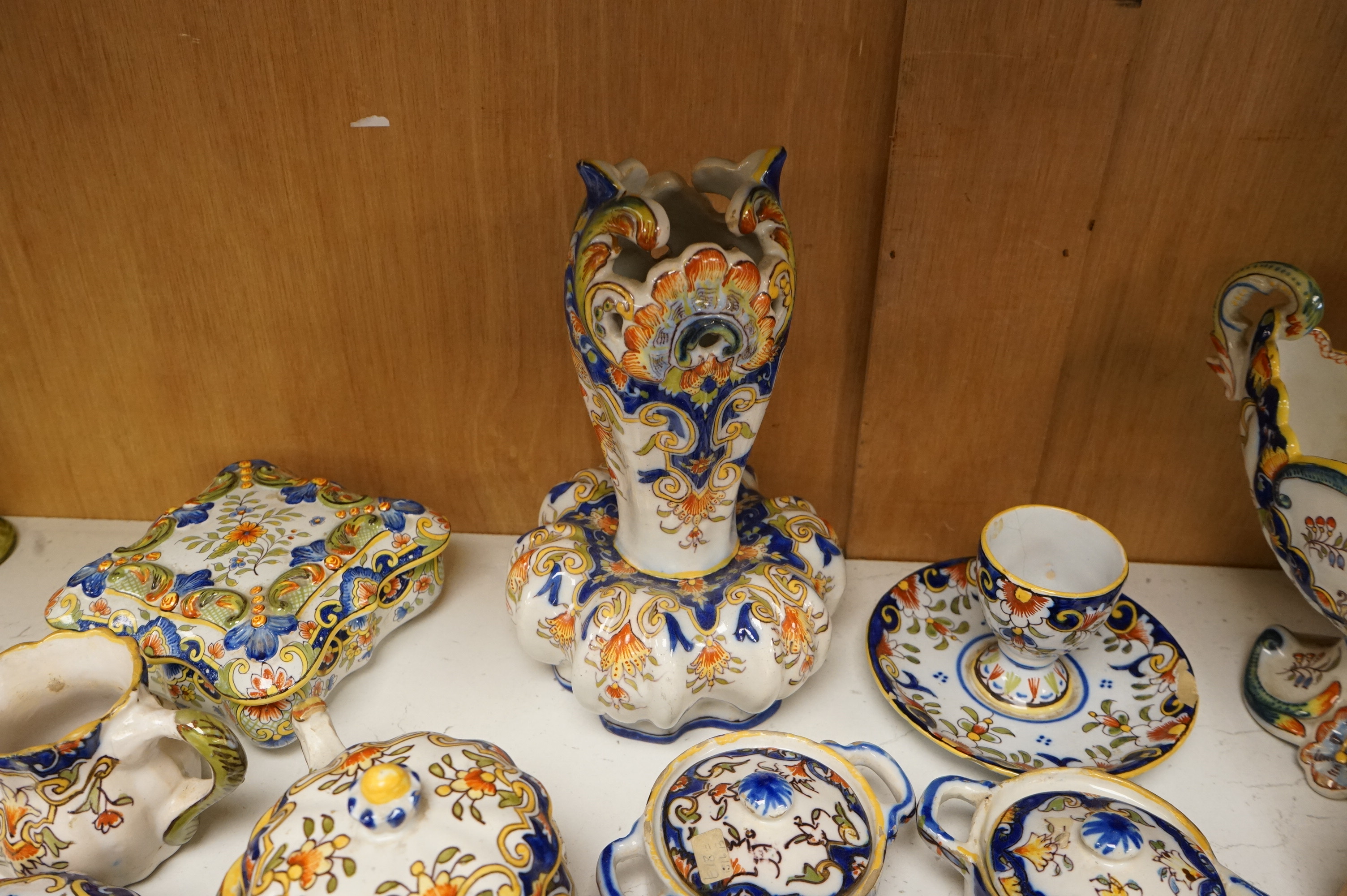 A group of French faience pottery to include trinket boxes, a teapot and vases, largest 32cm in length